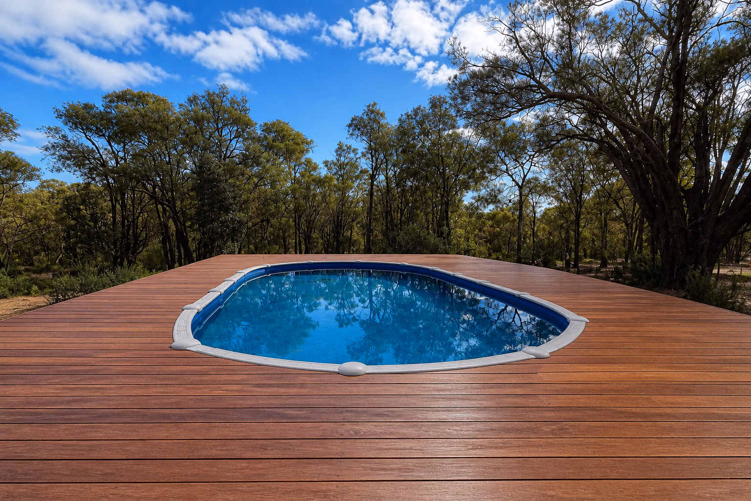 A finished timber deck surrounding an oval pool